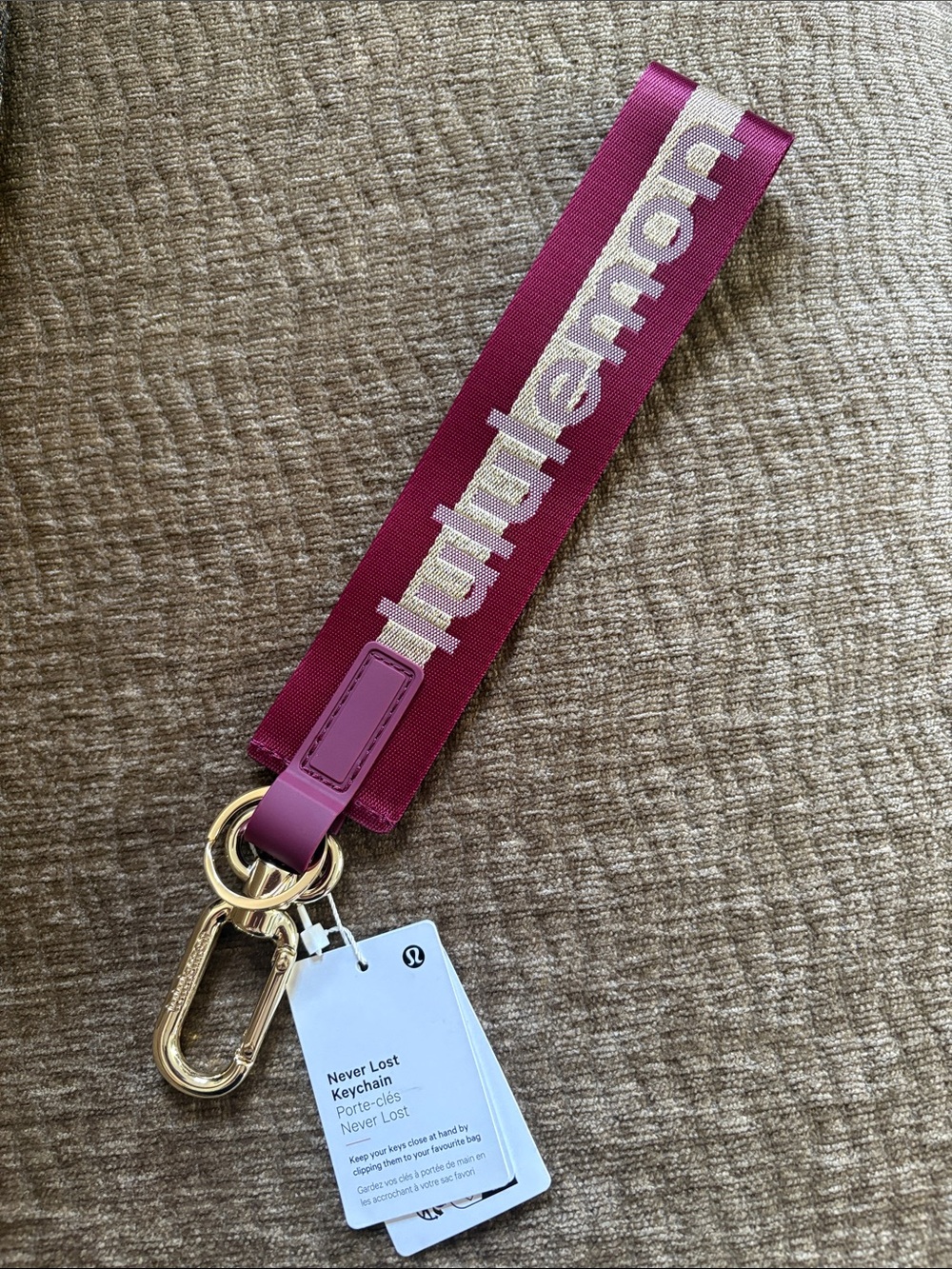 lululemon athletica Never Lost Wrist Key Strap in Magenta with Gold Hardware